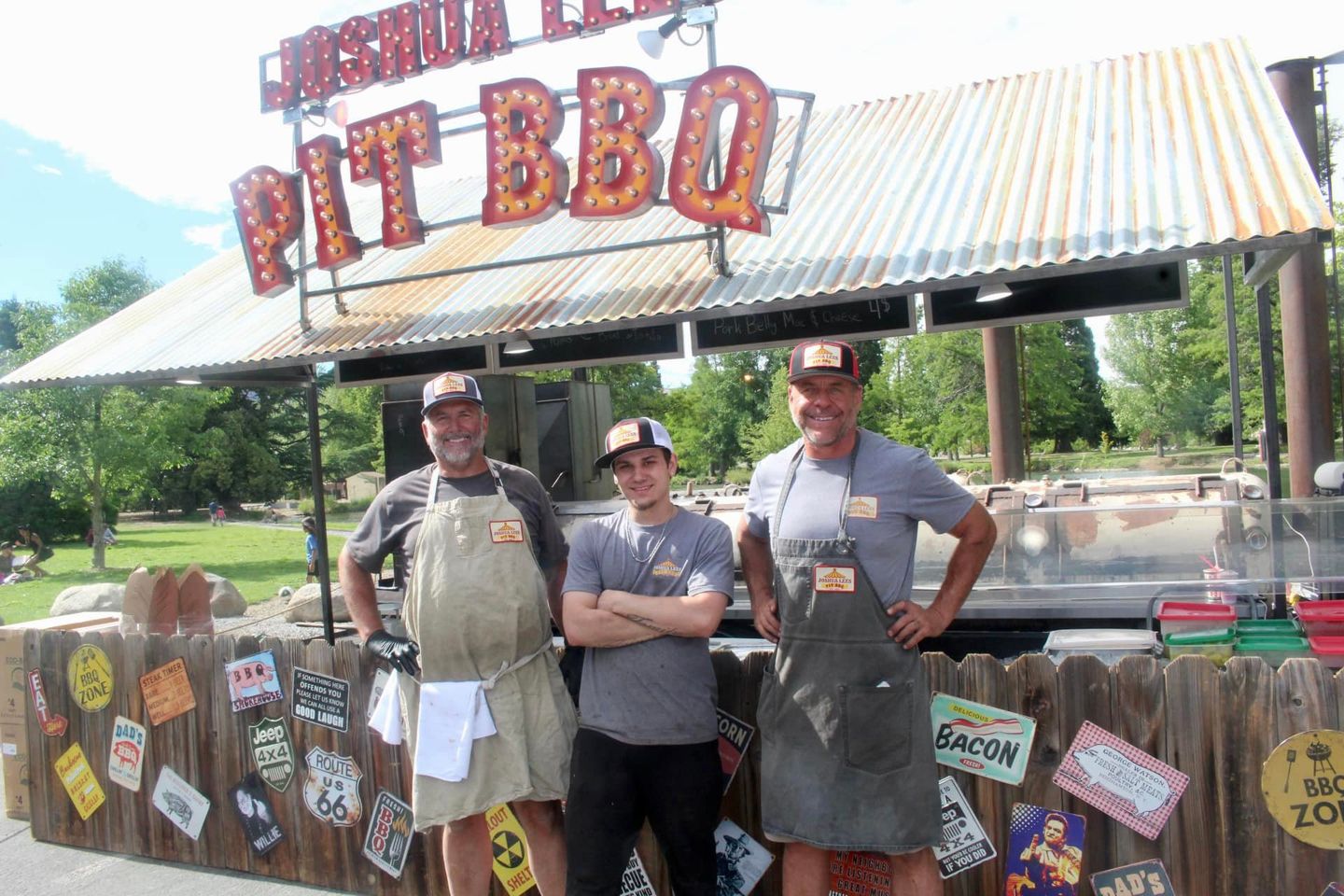 The Joshua Lees Pit BBQ crew in front of the smoker